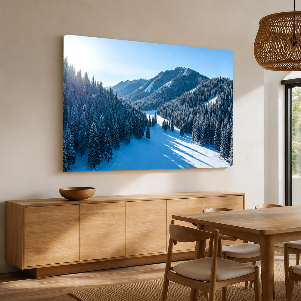 Snowy Woodland Valley canvas wall art, angled mockup above a sideboard.