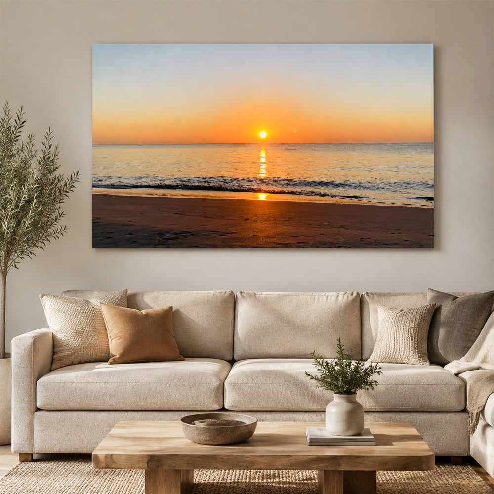 Golden Ocean Sunrise canvas wall art, living room mockup above a sofa.