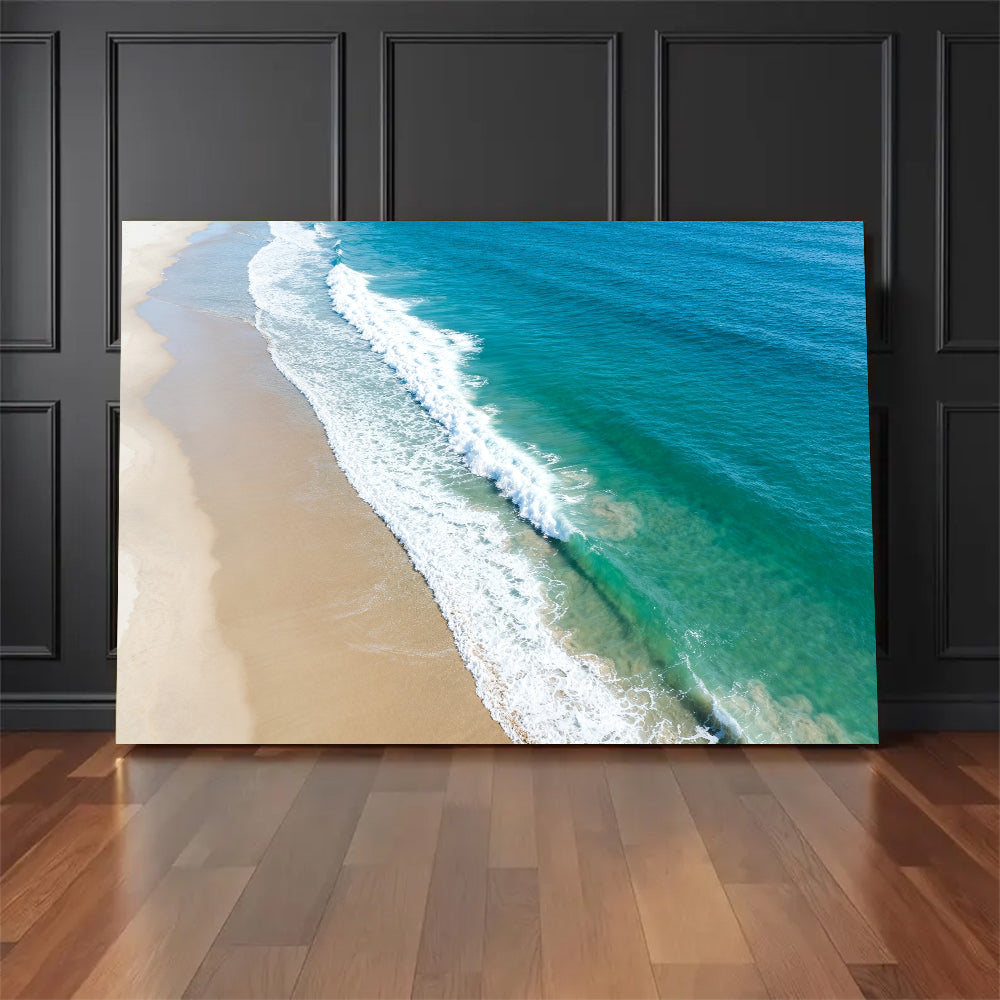 Aerial Sand and Surf canvas wall art, floor display against a dark wall.