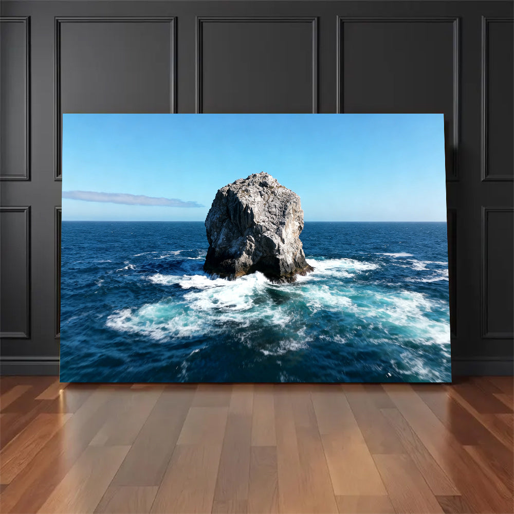 Solitary Sea Stack canvas wall art, floor display against a dark wall.