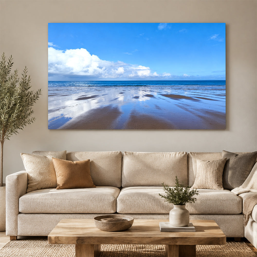 Blue Sky Tidal Flats canvas wall art, living room mockup above a sofa.