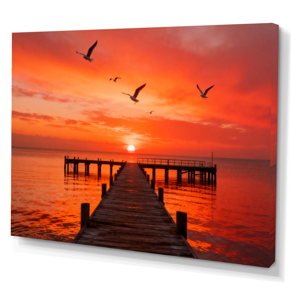 Seabirds over Crimson Pier canvas wall art, angled canvas mockup on a white background.