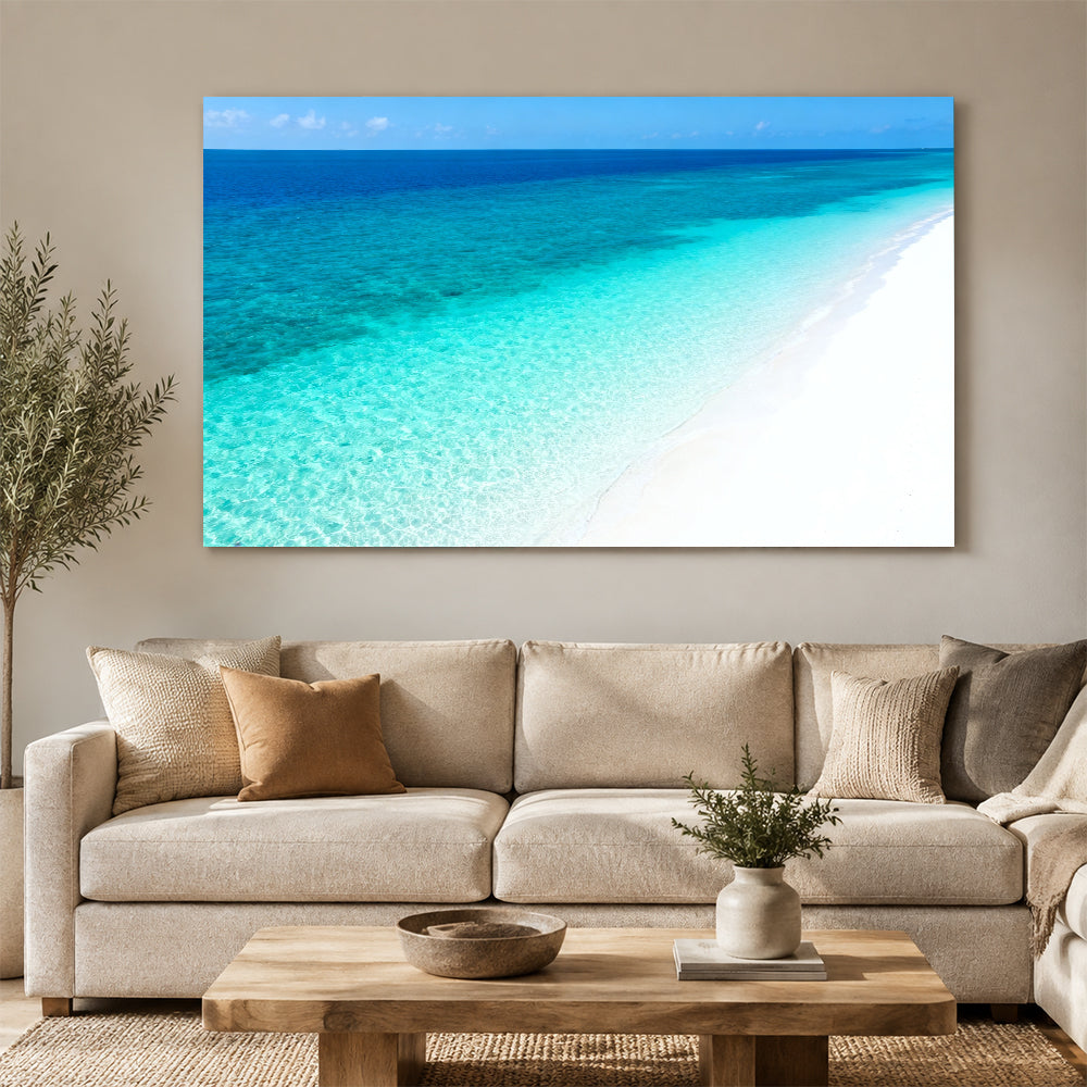 Clear Blue Sandbank canvas wall art, living room mockup above a sofa.