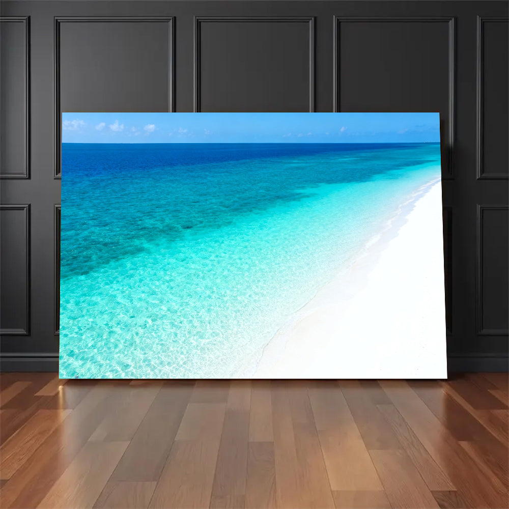 Clear Blue Sandbank canvas wall art, floor display against a dark wall.