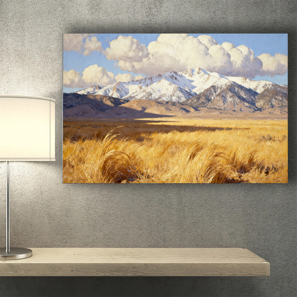 Golden Grass below Snowy Peaks canvas wall art, desk mockup.