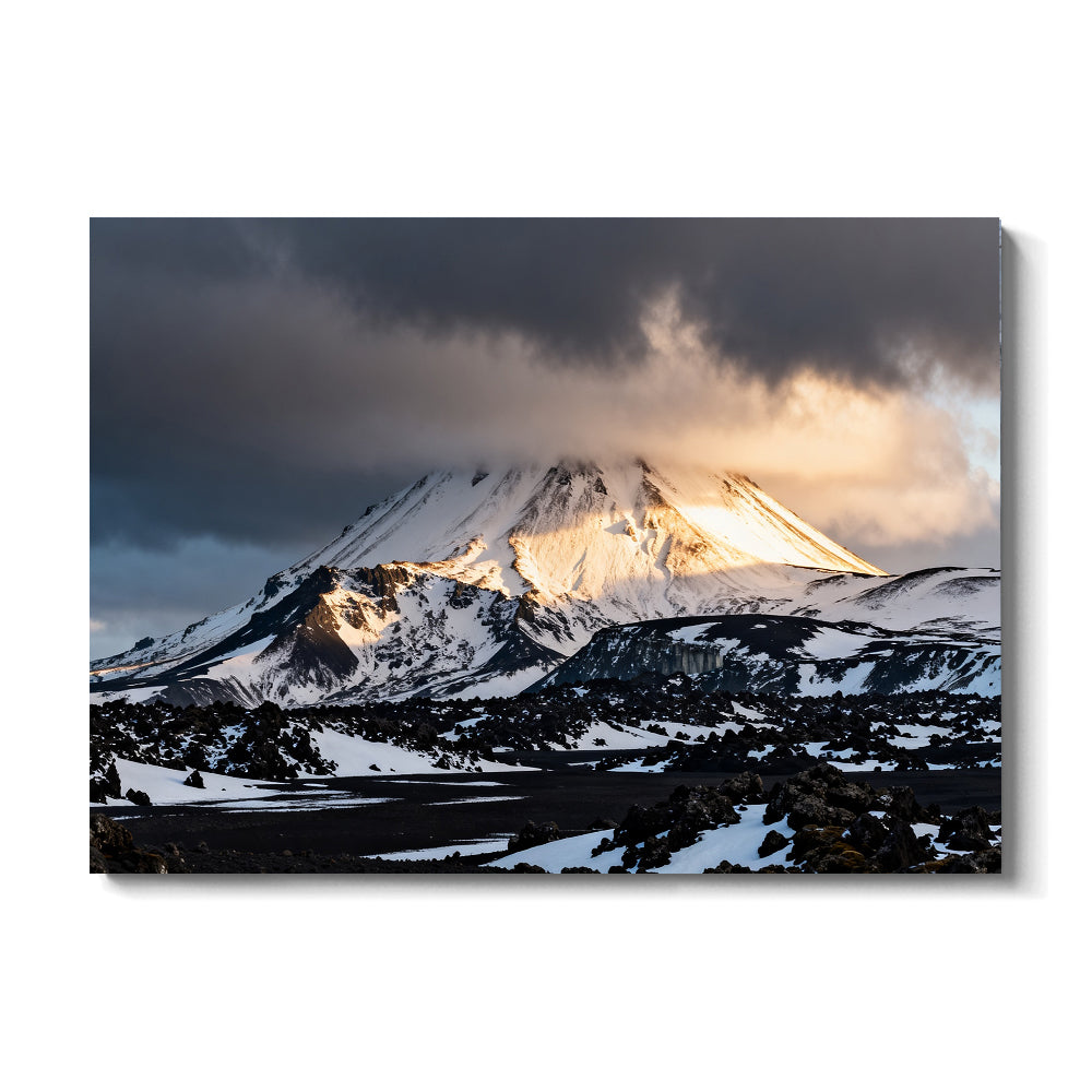 Stormlight on a Snowy Volcano canvas wall art, front view on a white background.
