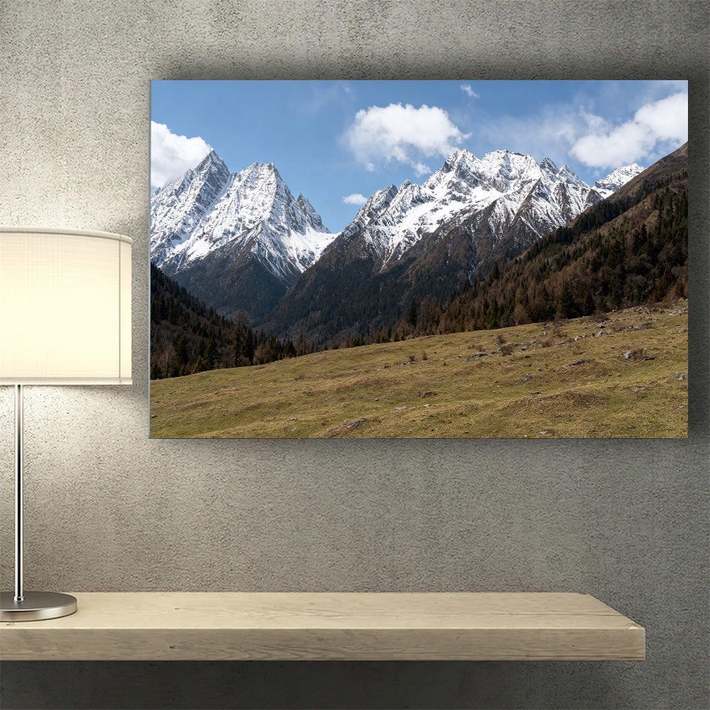 Snowy Ridge above Alpine Grass canvas wall art, desk mockup.