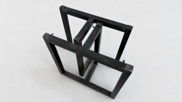 Anti-slip pads being applied to the corners and edges of metal table legs