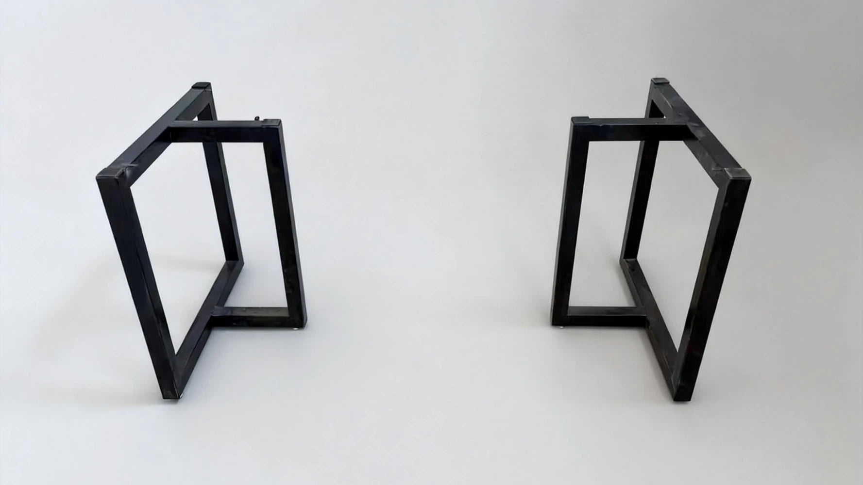 Metal table base placed in a suitable position before setting the tabletop